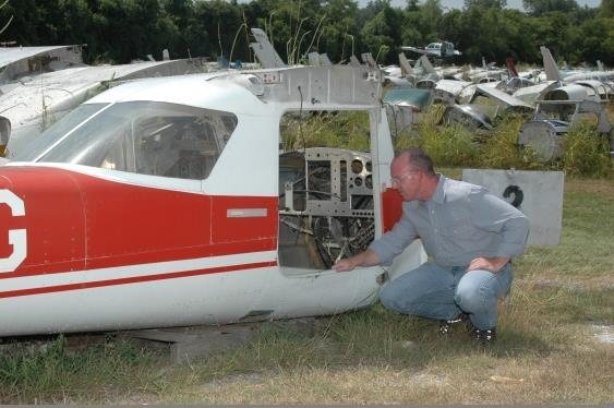 Man inspecting airplane
